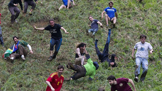 Not even COVID can stop Brits from rolling a stinky cheese down a steep hill